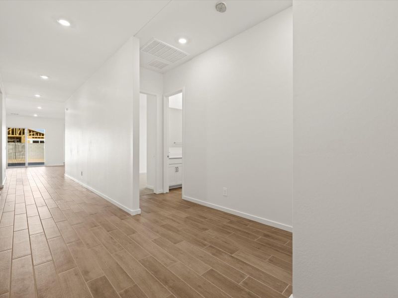 Spacious, unfurnished interior of a new home in White Tank Foothills Signature Series, Waddell (Image 9).