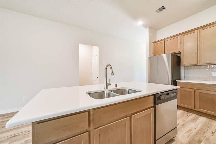 The kitchen also boasts an upgraded Kenmore dishwasher and a three quarter horsepower garbage disposal for added convenience. Looking toward the refrigerator, you will notice the cabinet space above for extra storage, complemented by 42 inch upper cabinets throughout. The kitchen also boasts an upgraded Kenmore dishwasher and a three quarter horsepower garbage disposal for added convenience. Looking toward the refrigerator, you will notice the cabinet space above for extra storage, complemented by 42 inch upper cabinets throughout.
