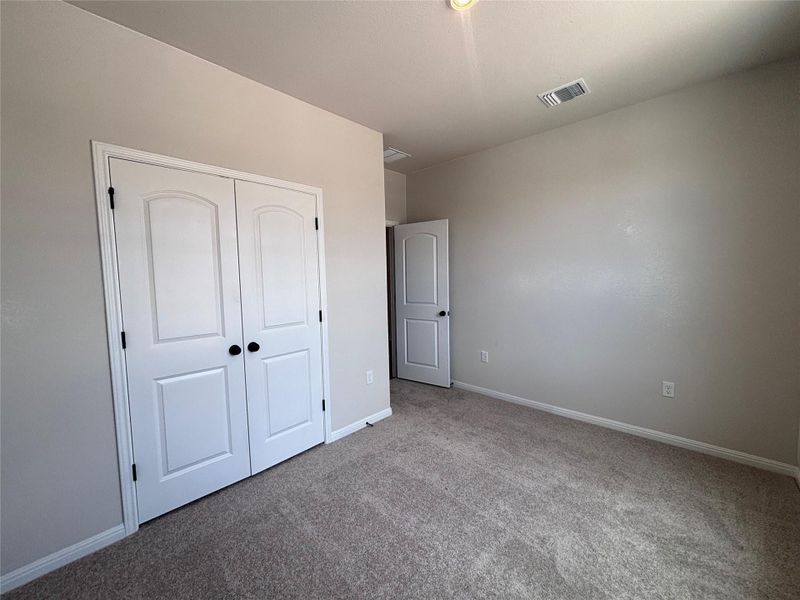 Spacious, unfurnished interior of a new home in The Colony, Bastrop (Image 10).
