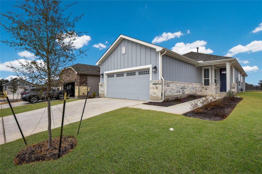 Front exterior of a new home in Sun City Texas, Georgetown, TX, highlighting curb appeal (Image 20).