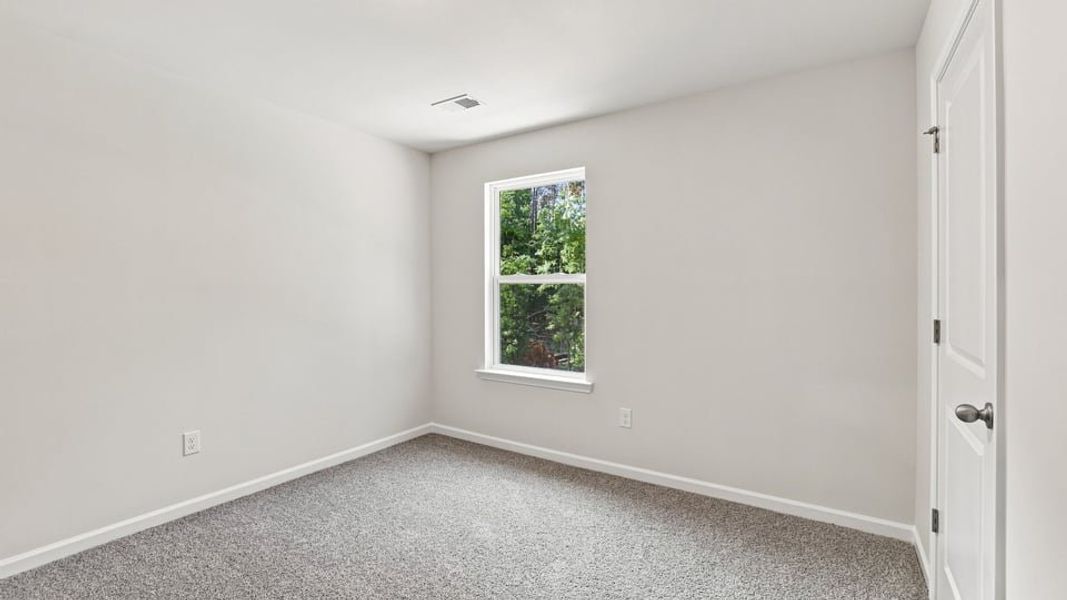 Spacious, unfurnished interior of a new home in Bentley Park, Greenwood (Image 27).
