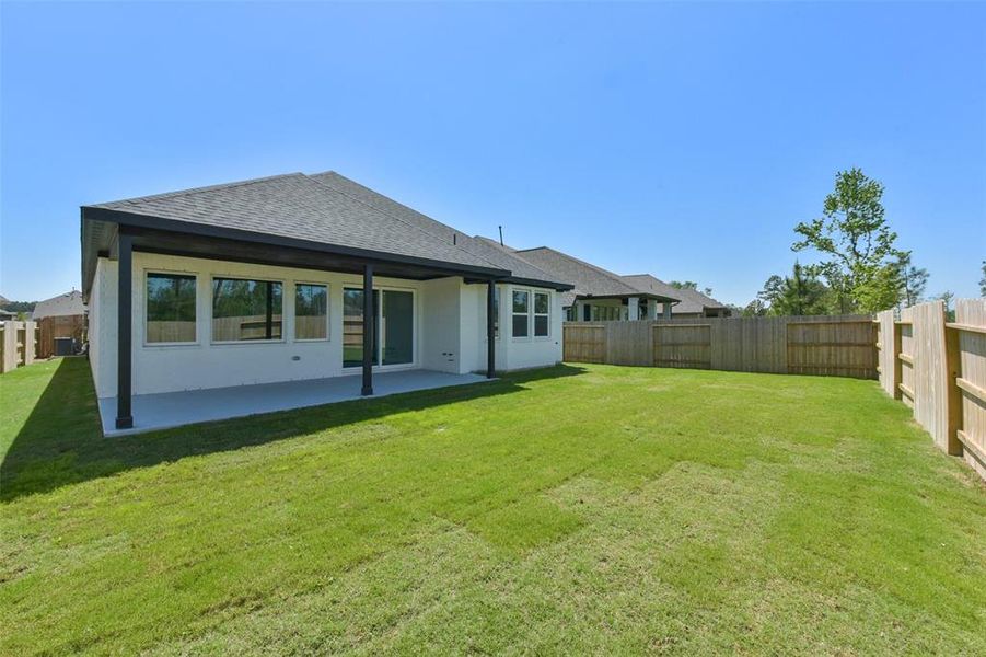 Front exterior of a new home in Evergreen 50', Conroe, TX, highlighting curb appeal (Image 22).