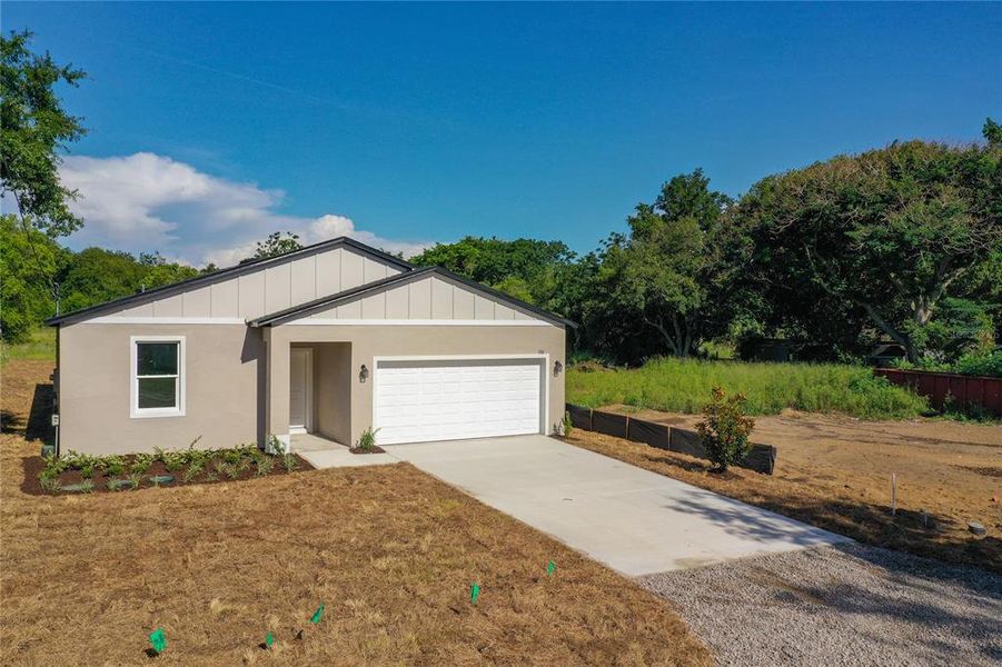 Front exterior of a new home in , Eustis, FL, highlighting curb appeal (Image 1). Front exterior of a new home in , Eustis, FL, highlighting curb appeal (Image 1).