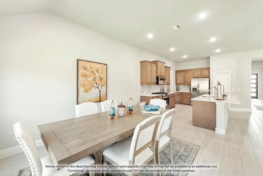 Open dining area with wood table flowing into kitchen with brown cabinets and center island Open dining area with wood table flowing into kitchen with brown cabinets and center island