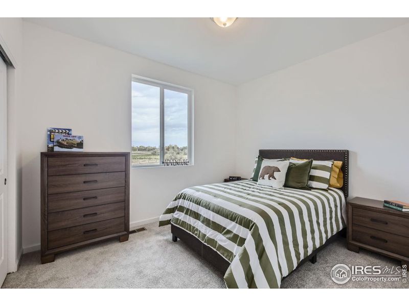 Fourth bedroom *Photo not of actual home, but same floorplan and style*