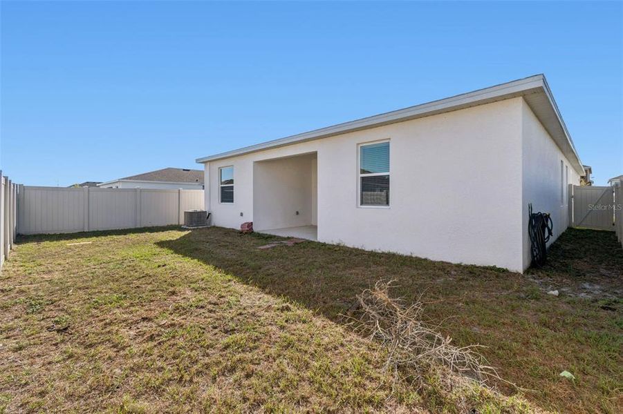 Exterior details and patio area of a home in Ranches at Lake McLeod, Eagle Lake (Image 33).