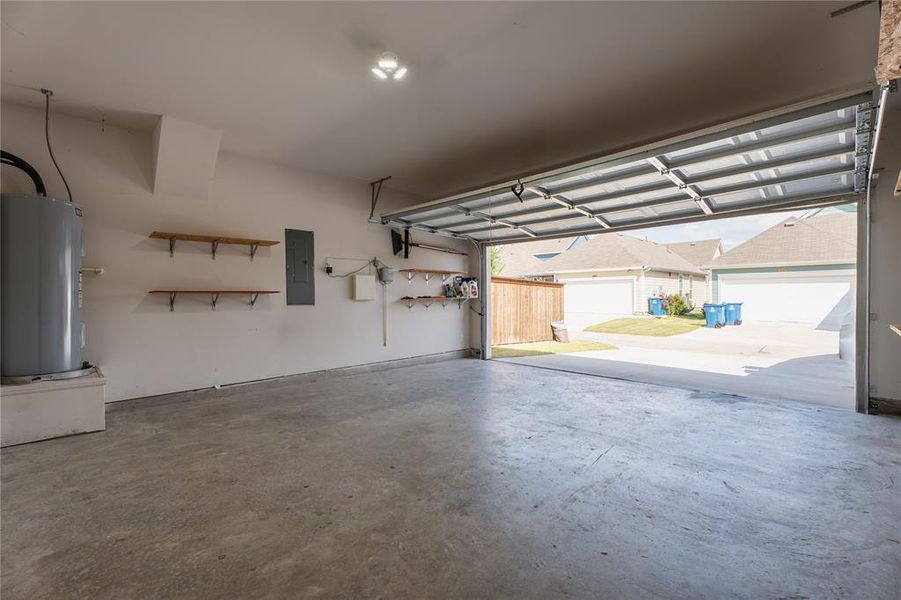 Garage with electric water heater and electric panel