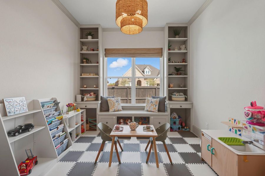 Study/office/playroom with custom built-in shelves. Study/office/playroom with custom built-in shelves.