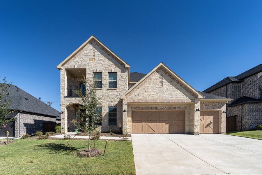 Front exterior of a new home in Sonoma Verde, Rockwall, TX, highlighting curb appeal (Image 1). Front exterior of a new home in Sonoma Verde, Rockwall, TX, highlighting curb appeal (Image 1).
