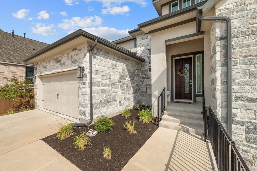 Front exterior of a new home in , Leander, TX, highlighting curb appeal (Image 2). Front exterior of a new home in , Leander, TX, highlighting curb appeal (Image 2).