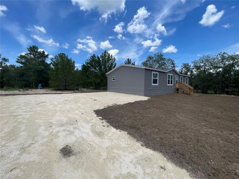 Front exterior of a new home in , Ocala, FL, highlighting curb appeal (Image 2).