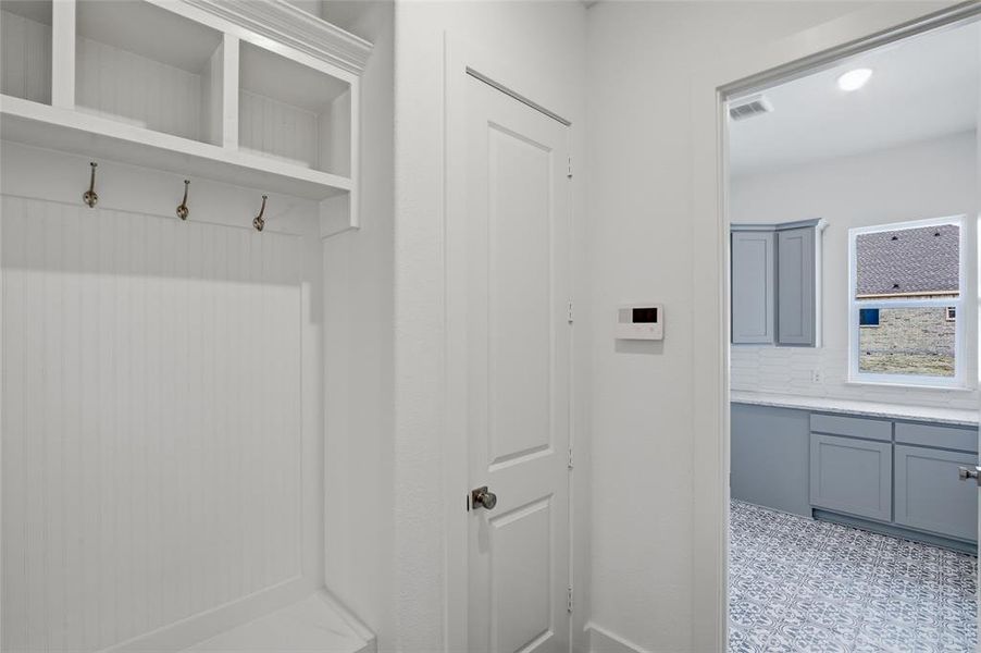 Mudroom featuring light flooring