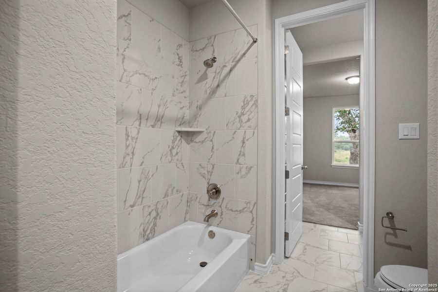 Furnished interior view inside a new home in Potranco Oaks, Castroville (Image 36).