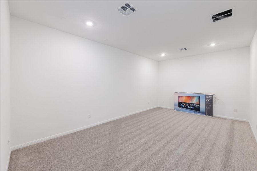Basement with carpet flooring and recessed lighting