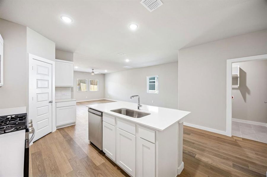 Kitchen in the Willow home plan by Trophy Signature Homes – REPRESENTATIVE PHOTO