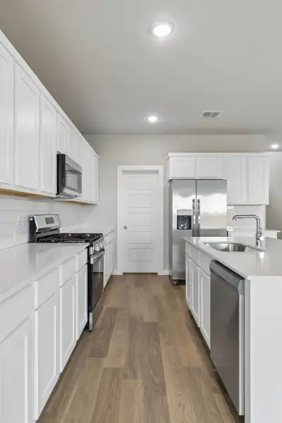 Kitchen in the Winters home plan by Trophy Signature Homes – REPRESENTATIVE PHOTO