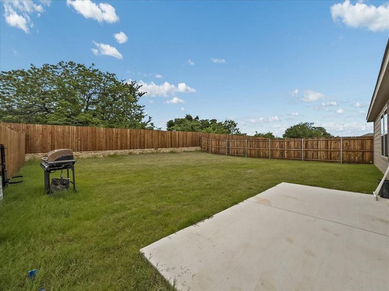 Exterior details and patio area of a home in Townsend Green, Denton (Image 4).