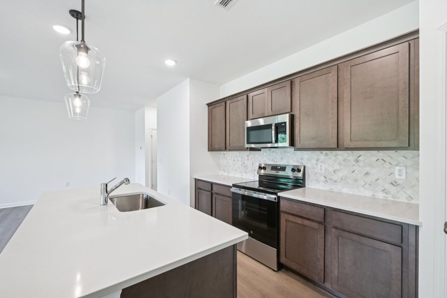 Representative furnished interior of a home built from the Meadow by Ashton Woods in Middleton Farms, Middlesex (Image 5).
