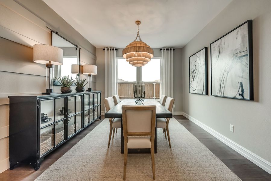 Formal dining room with large windows