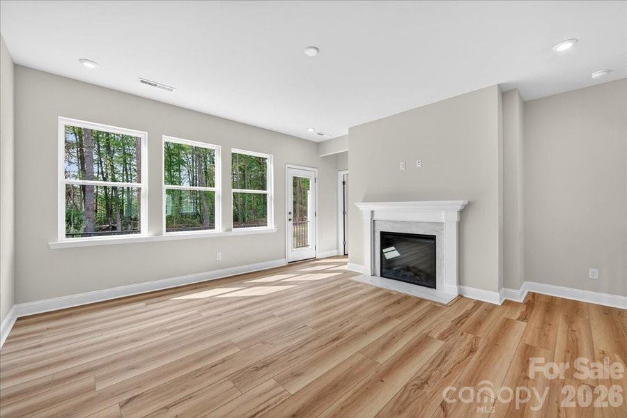 Ample natural light in living room with access to outdoor living