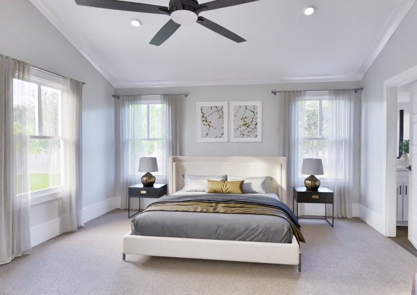 A spacious bedroom with vaulted ceiling, ceiling fan and several windows creating an elegant retreat.