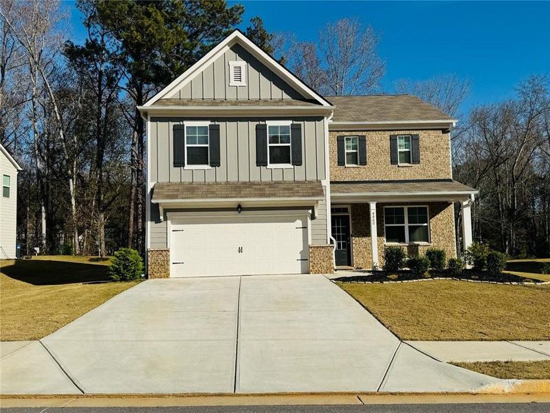 Front exterior of a new home in , Powder Springs, GA, highlighting curb appeal (Image 1). Front exterior of a new home in , Powder Springs, GA, highlighting curb appeal (Image 1).