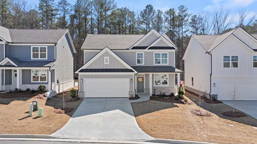 Front exterior of a new home in Hamptons at Riverwood South, Dallas, GA, highlighting curb appeal (Image 1).