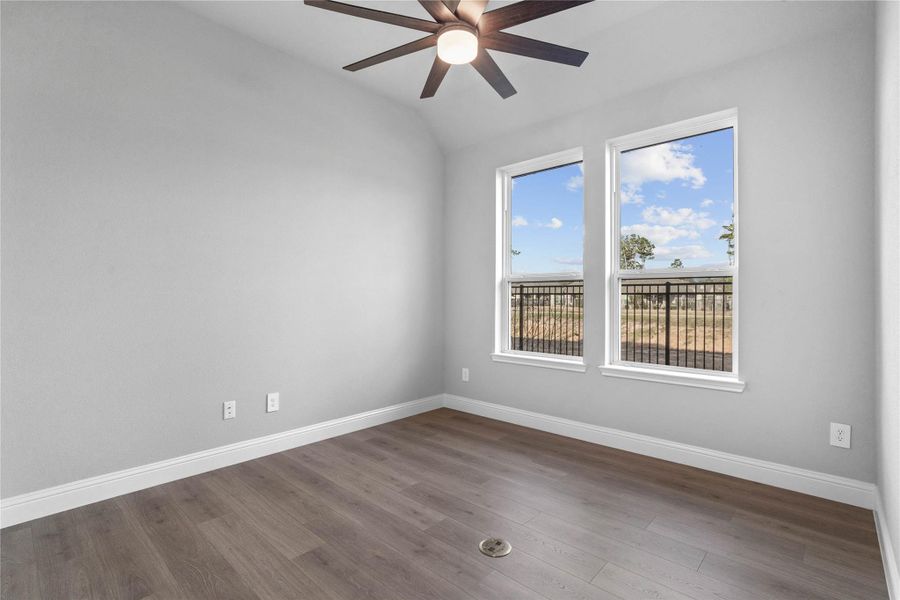 Perfect for entertaining is this amazing Game Room! This space would be a fabulous teen hangout or adult game room! Featuring laminate flooring, high sloped ceiling with ceiling fan, custom paint and large windows.
