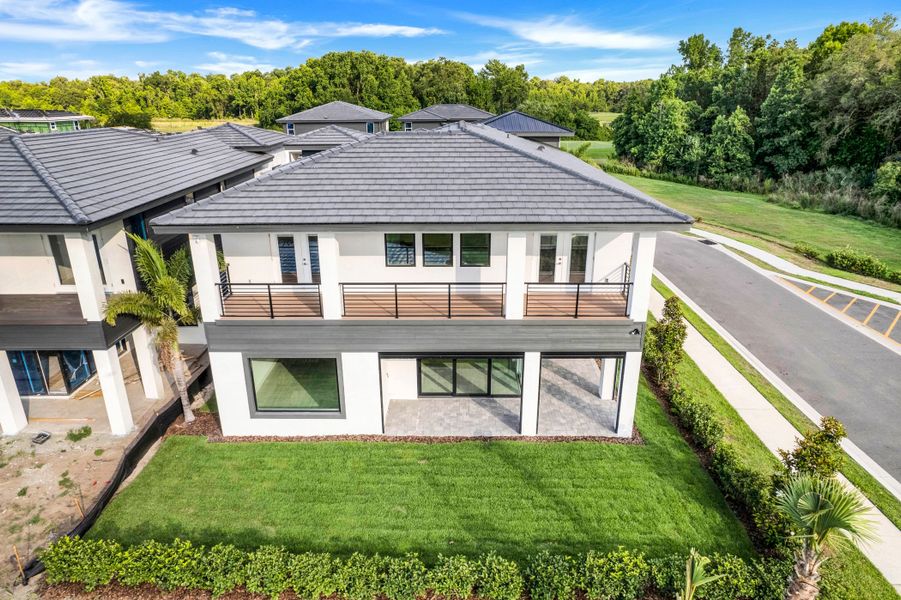 Exterior details and patio area of a home in Hampton Green at Providence, Davenport (Image 4).