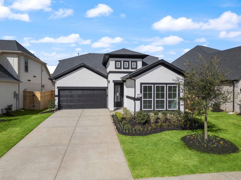 Front exterior of a new home in Sienna 45', 50', Missouri City, TX, highlighting curb appeal (Image 19). Front exterior of a new home in Sienna 45', 50', Missouri City, TX, highlighting curb appeal (Image 19).