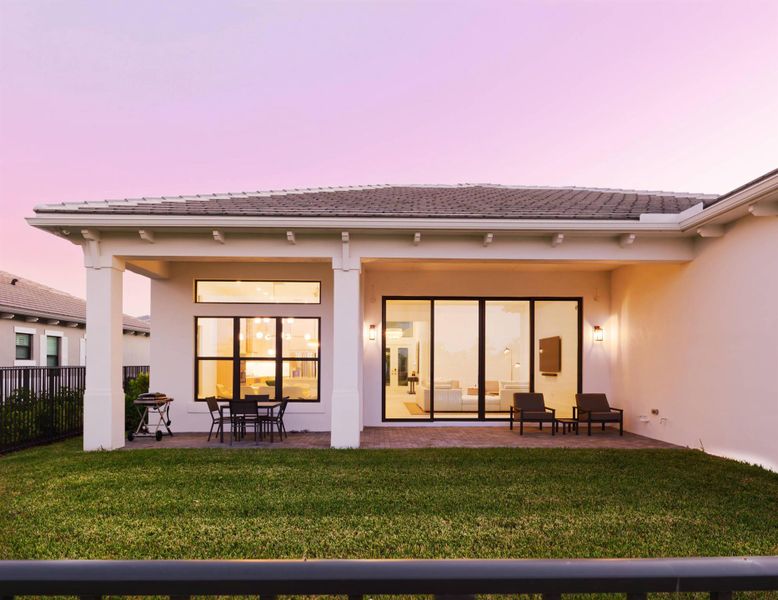 Exterior details and patio area of a home in Apex at Avenir, Palm Beach Gardens (Image 3).