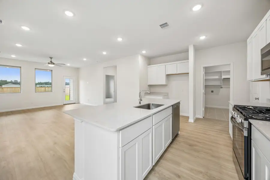 Kitchen in the Magnolia home plan by Trophy Signature Homes – REPRESENTATIVE PHOTO