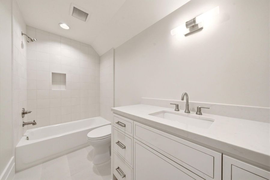Third floor bathroom in between game room and bedroom suite. Third floor bathroom in between game room and bedroom suite.