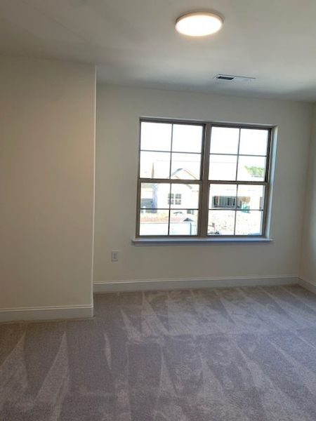 Spacious, unfurnished interior of a new home in Royal Pines, Trinity (Image 32).
