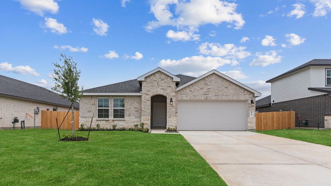 Front exterior of a new home in Caldwell Crossing, Iowa Colony, TX, highlighting curb appeal (Image 1). Front exterior of a new home in Caldwell Crossing, Iowa Colony, TX, highlighting curb appeal (Image 1).
