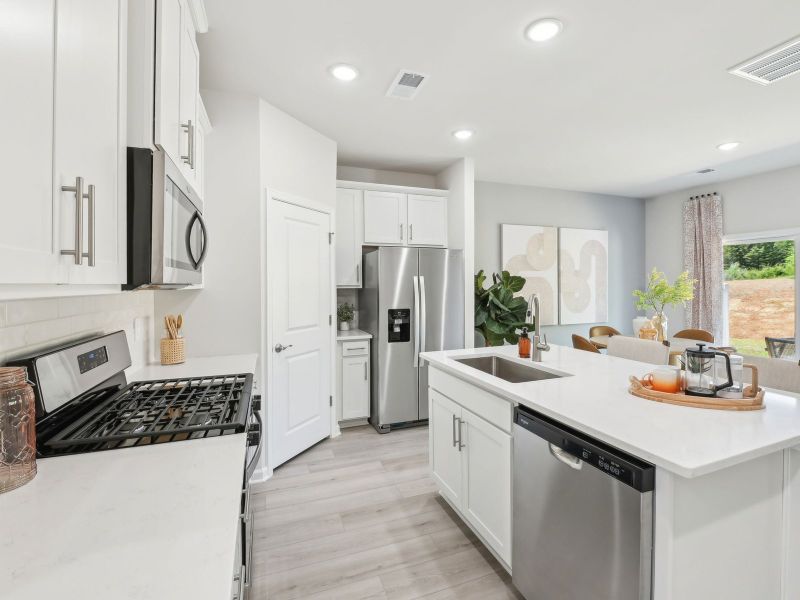 Kitchen in the Topaz floorplan at a Meritage Homes community in Mebane, NC.
