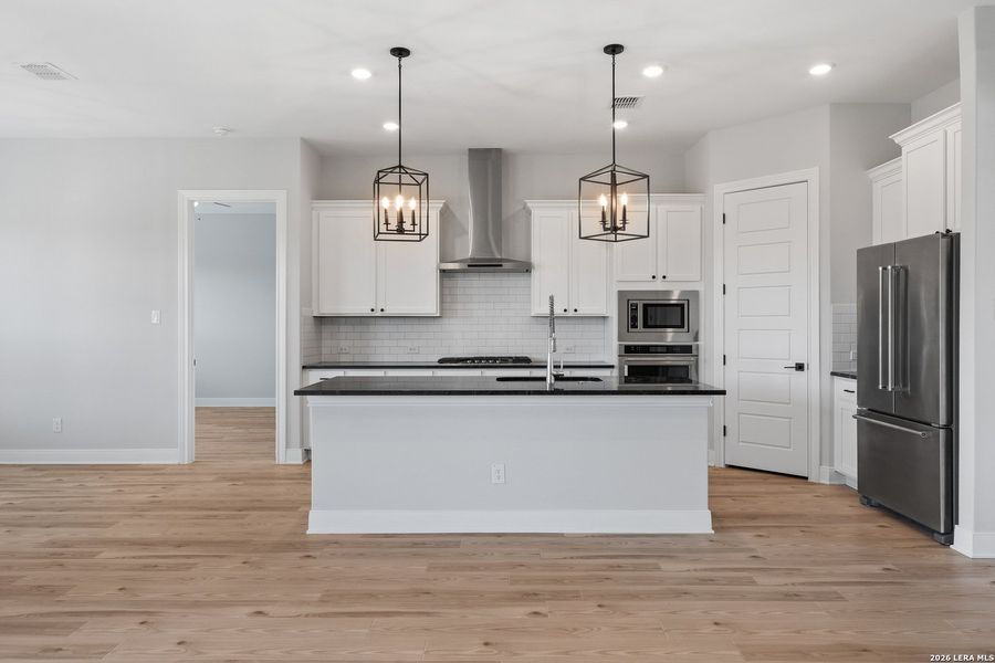 Furnished interior view inside a new home in Potranco West, Castroville (Image 8).