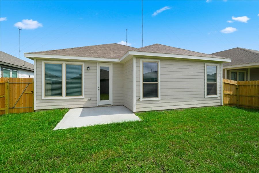 Step outside to the inviting patio slab overlooking the private, fenced backyard with ample green space. Step outside to the inviting patio slab overlooking the private, fenced backyard with ample green space.