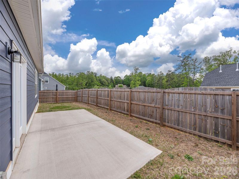 Exterior details and patio area of a home in , Fletcher (Image 22).