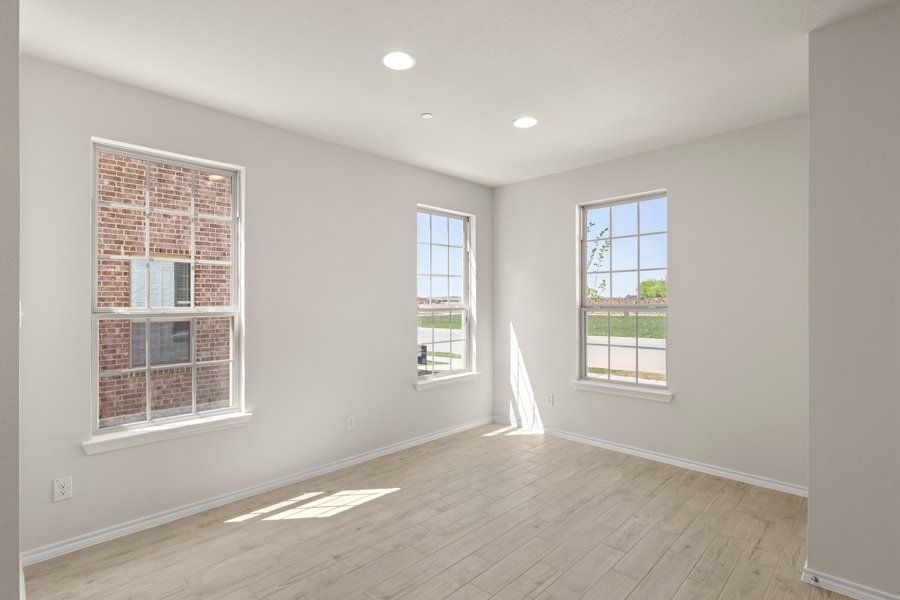 Front exterior of a new home in Sanger Circle, Sanger, TX, highlighting curb appeal (Image 7).