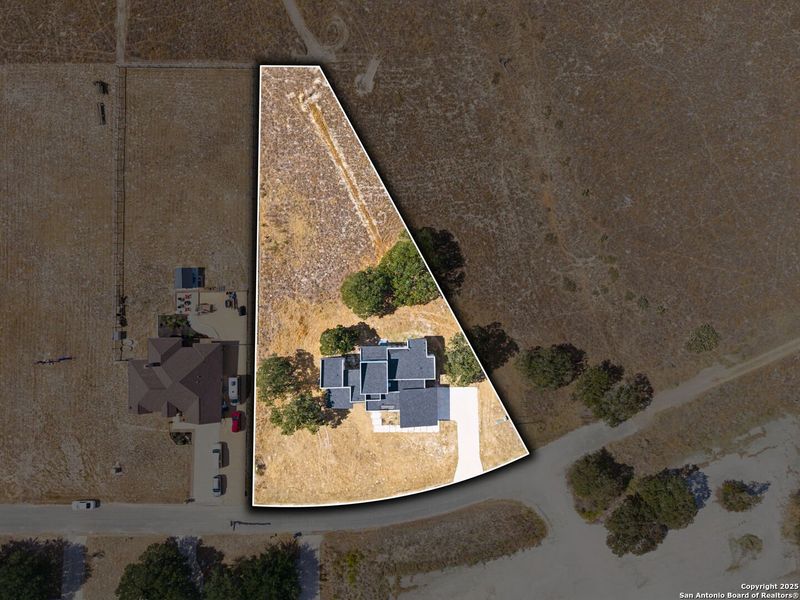 Front exterior of a new home in , La Vernia, TX, highlighting curb appeal (Image 2).