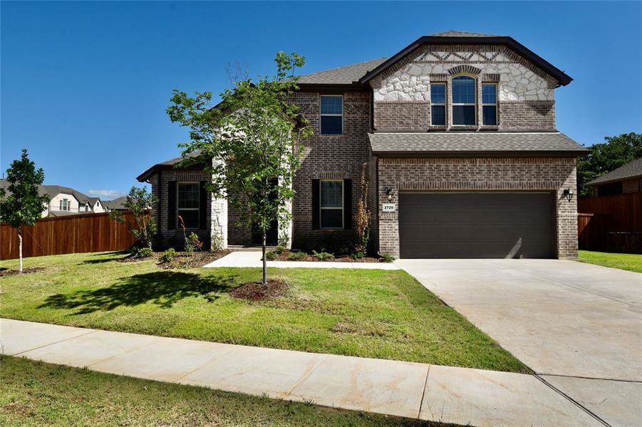 Front exterior of a home in the Amherst Addition community, located in Corinth, TX (Image 6). Front exterior of a home in the Amherst Addition community, located in Corinth, TX (Image 6).