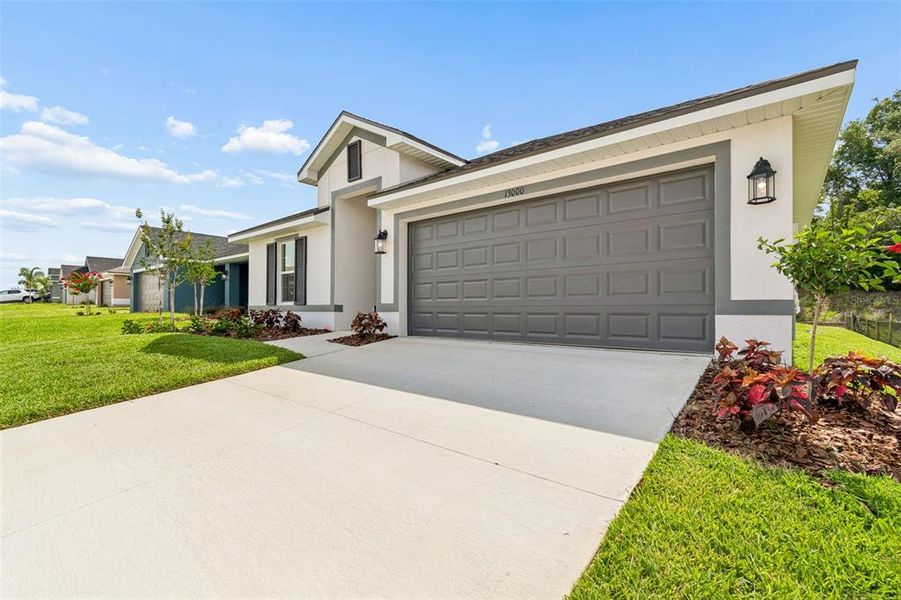 Front exterior of a new home in Abbey Glen, Dade City, FL, highlighting curb appeal (Image 28). Front exterior of a new home in Abbey Glen, Dade City, FL, highlighting curb appeal (Image 28).