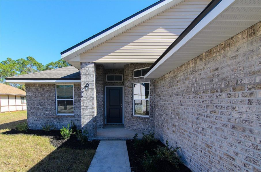 Exterior details and patio area of a home in Palm Coast, Palm Coast (Image 2).