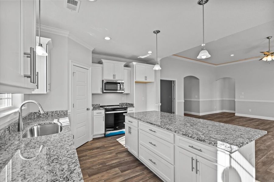 Representative furnished interior of a home built from the Roosevelt by Enchanted Homes in Guadalupe Heights, Seguin (Image 7).