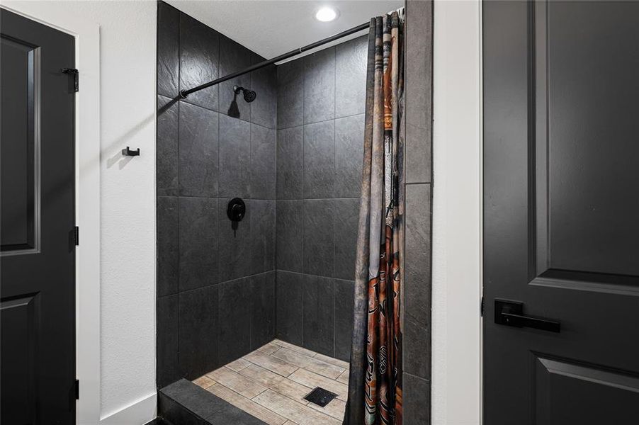 Bathroom featuring tiled shower