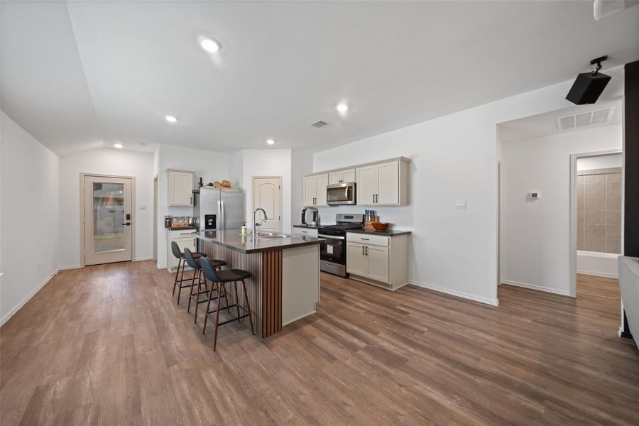 In the right of the frame is the hallway to the secondry Bedrooms. In the right of the frame is the hallway to the secondry Bedrooms.