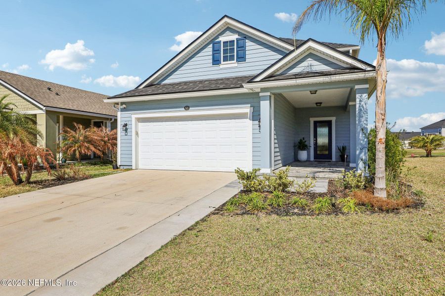 Front exterior of a new home in Beacon Lake, St. Augustine, FL, highlighting curb appeal (Image 26).