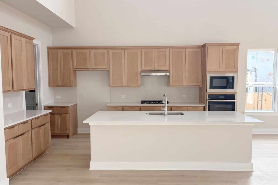 Furnished interior view inside a new home in The Grove at Blackhawk, Pflugerville (Image 5). Furnished interior view inside a new home in The Grove at Blackhawk, Pflugerville (Image 5).