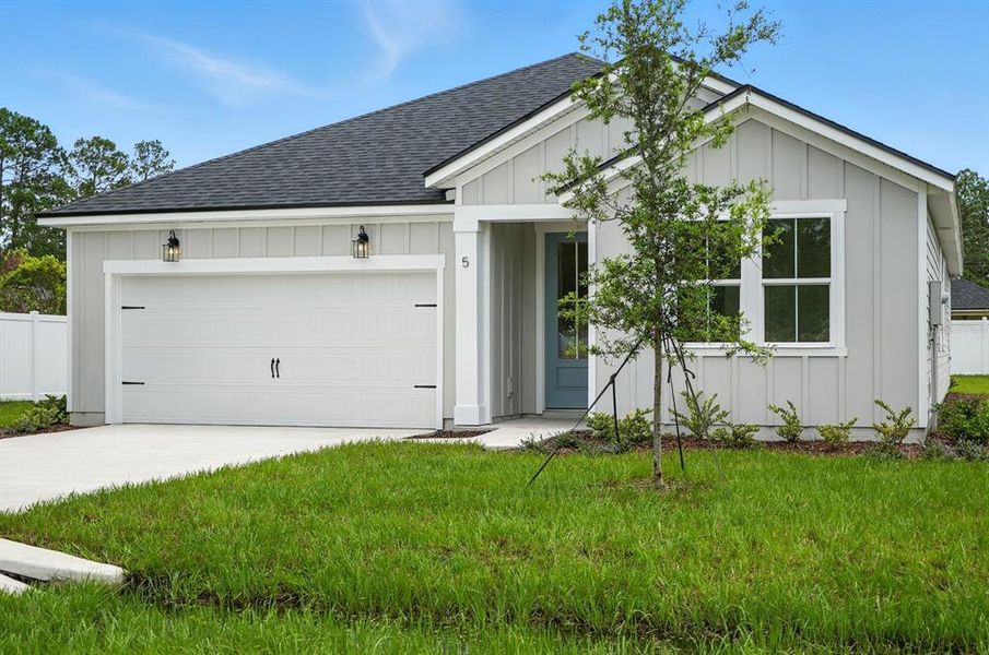 Front exterior of a new home in Palm Coast Homes, Palm Coast, FL, highlighting curb appeal (Image 20). Front exterior of a new home in Palm Coast Homes, Palm Coast, FL, highlighting curb appeal (Image 20).